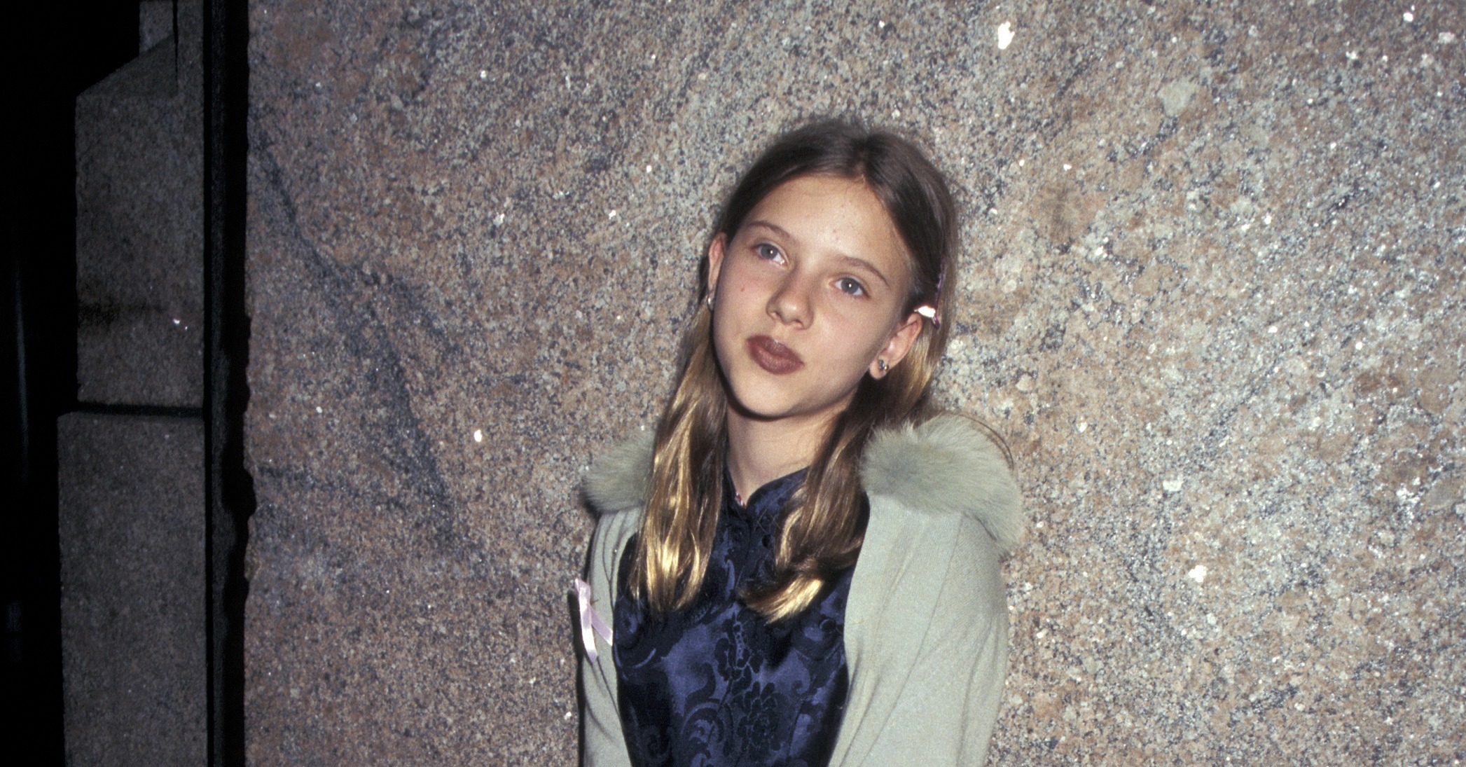 A fresh-faced, 12-year-old Scarlett posed at an event in 1996