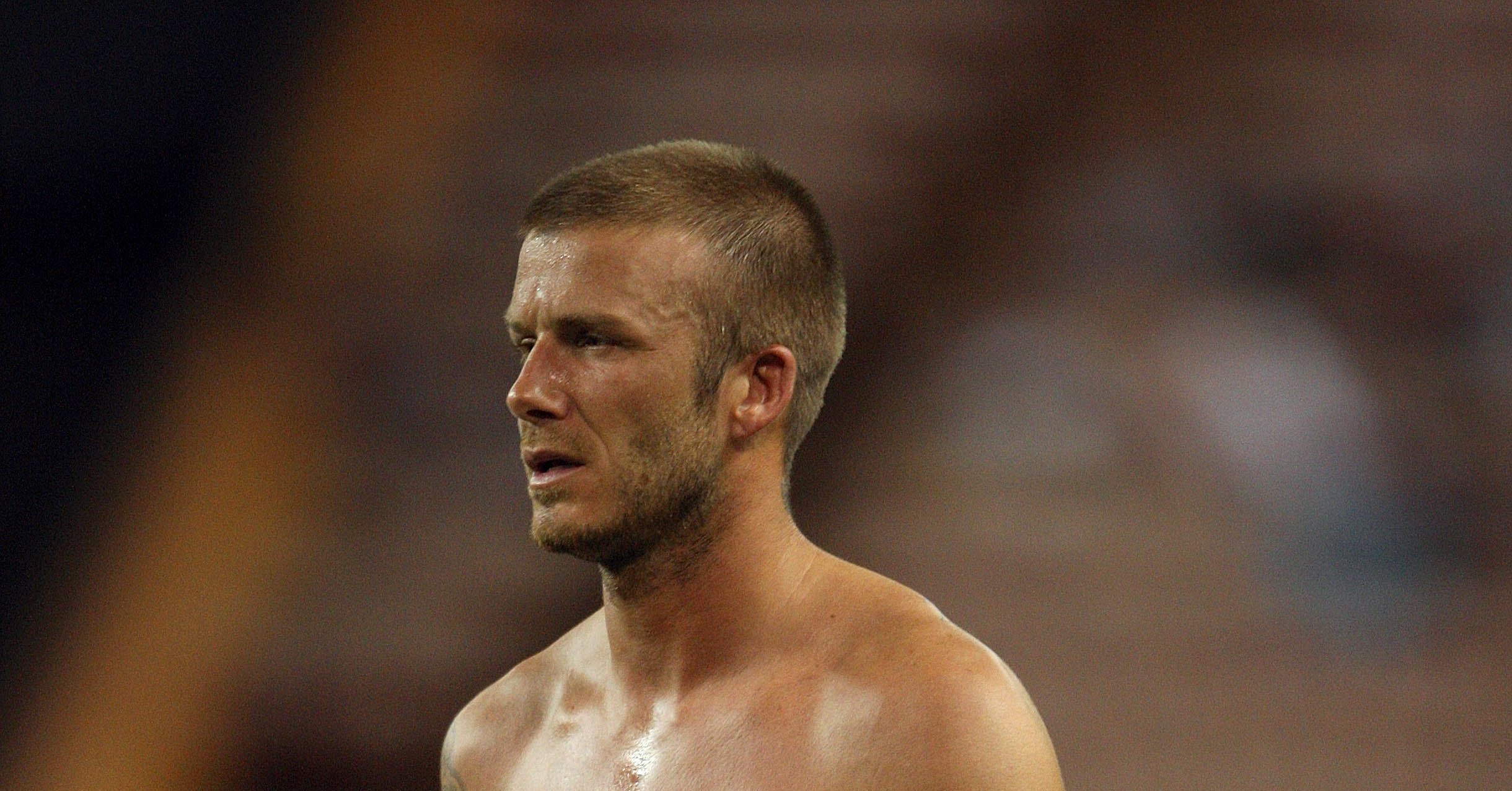 David Beckham walked around the field without his shirt during a