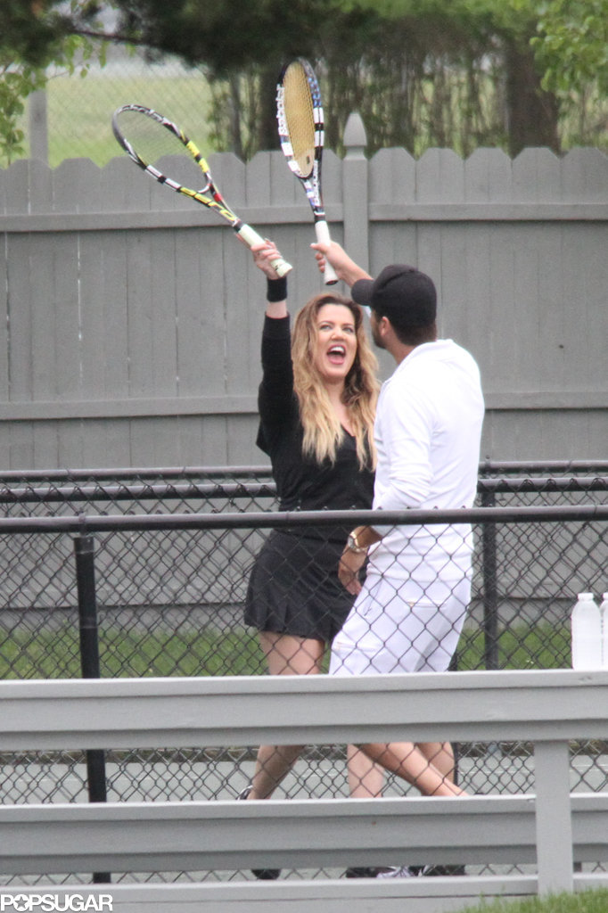 Khloé Kardashian and Scott Disick high fived with their tennis rackets in the Hamptons on Thursday.
Khloé Kardashian and Scott Disick high fived with their tennis rackets in the Hamptons on Thursday.
