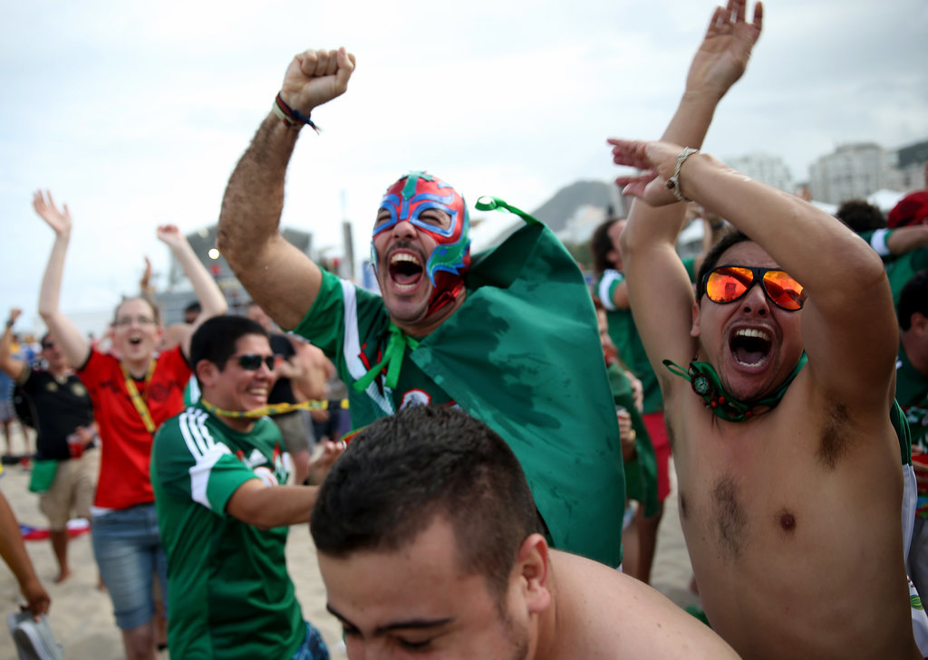 Fans of Mexico threw their hands up in the air when their team scored against Cameroon.
Fans of Mexico threw their hands up in the air when their team scored against Cameroon.
