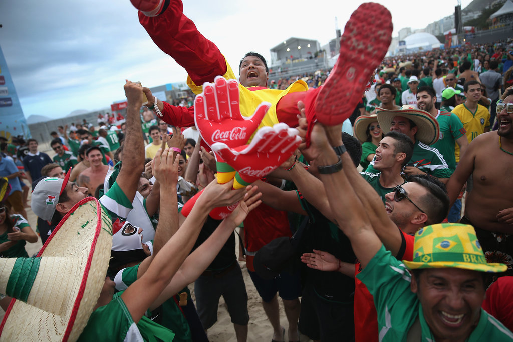 A Mexico fan crowd-surfed on Copacabana Beach in Brazil.
A Mexico fan crowd-surfed on Copacabana Beach in Brazil.