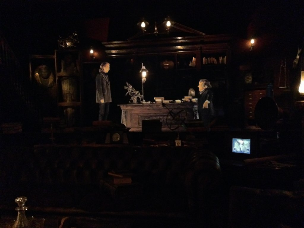 As you progress in the queue for the ride you stop to watch a preshow that takes place in Bill Weasley's office. There are real props in the foreground while the introduction takes place on a screen in the background. You can even see moving portraits of the Weasleys, including the photo of them in Egypt which is featured in the movie.
As you progress in the queue for the ride you stop to watch a preshow that takes place in Bill Weasley's office. There are real props in the foreground while the introduction takes place on a screen in the background. You can even see moving portraits of the Weasleys, including the photo of them in Egypt which is featured in the movie.