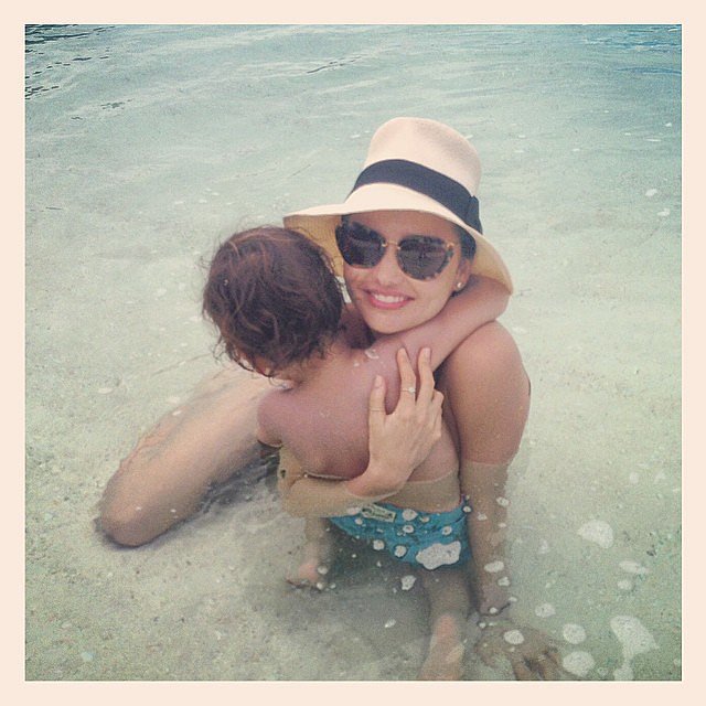 Miranda Kerr cuddled up with her son, Flynn, in the water. Source: Instagram user mirandakerr 