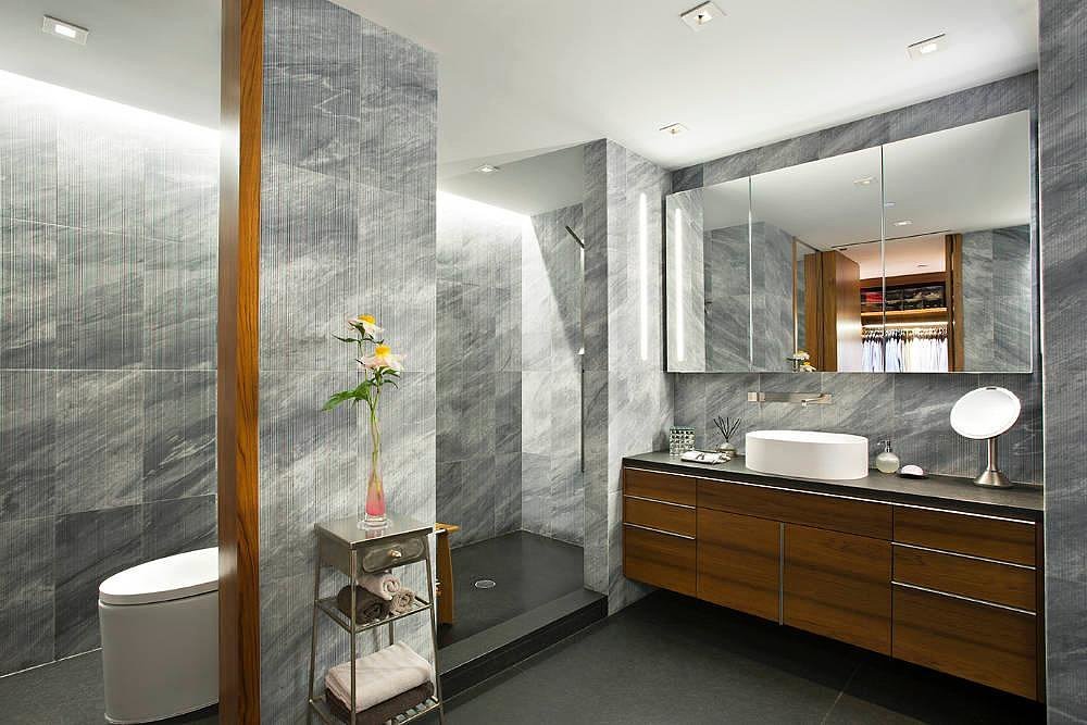 If she isn't in the mood for a long soak, there's a spacious shower.
Source: Town Real Estate
