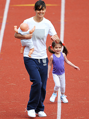 Katie Holmes and Suri Running On a Track Katie Holmes and Suri Running On a Track