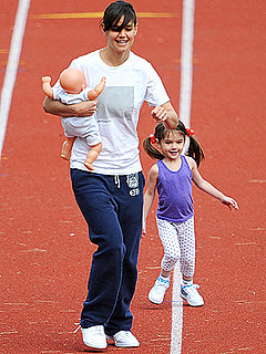Katie Holmes and Suri Running On a Track