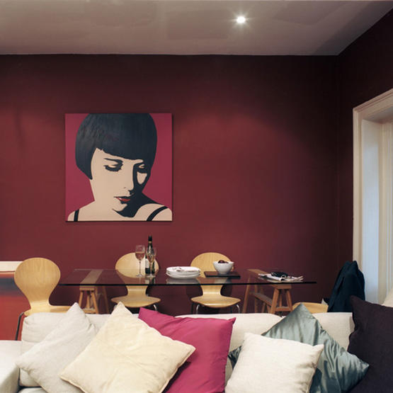 This deep, moody red creates a womb-like feel in this room. The modern art and light throw pillows keep the space from feeling too enclosing.
Source
This deep, moody red creates a womb-like feel in this room. The modern art and light throw pillows keep the space from feeling too enclosing.
Source