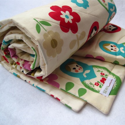 This Organic Matryoshka Doll Quilt ($110) is absolutely adorable, and it will match your matryoshka decor to a T!
This Organic Matryoshka Doll Quilt ($110) is absolutely adorable, and it will match your matryoshka decor to a T!