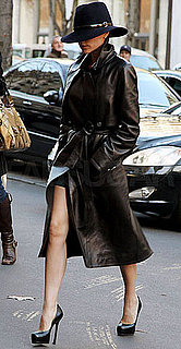Photo of Victoria Beckham Wearing Black Leather Trench Coat in Paris