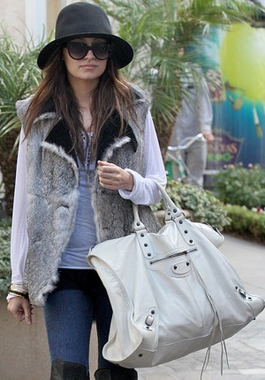 Nicole Richie Holiday Shopping at The Grove in LA in Fur Vest and Big White Balenciaga Bag