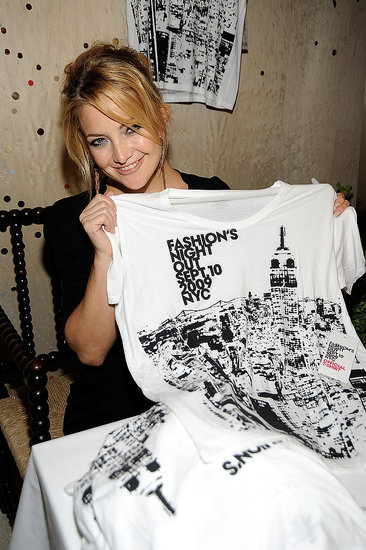Kate shows off the event's tee