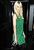Photo of Claudia Schiffer Wearing Green Leopard Dress and Alexander McQueen Clutch at London Fashion Week
