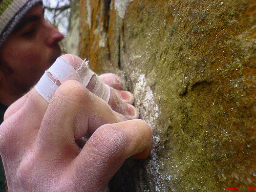 Definition: Crimping, rock climbing, grip