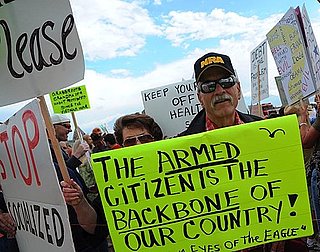 Front Page: People Keep Bringing Guns to Healthcare Protests
