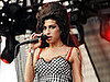 Amy Winehouse Won't Attend Grammys but Will Perform
