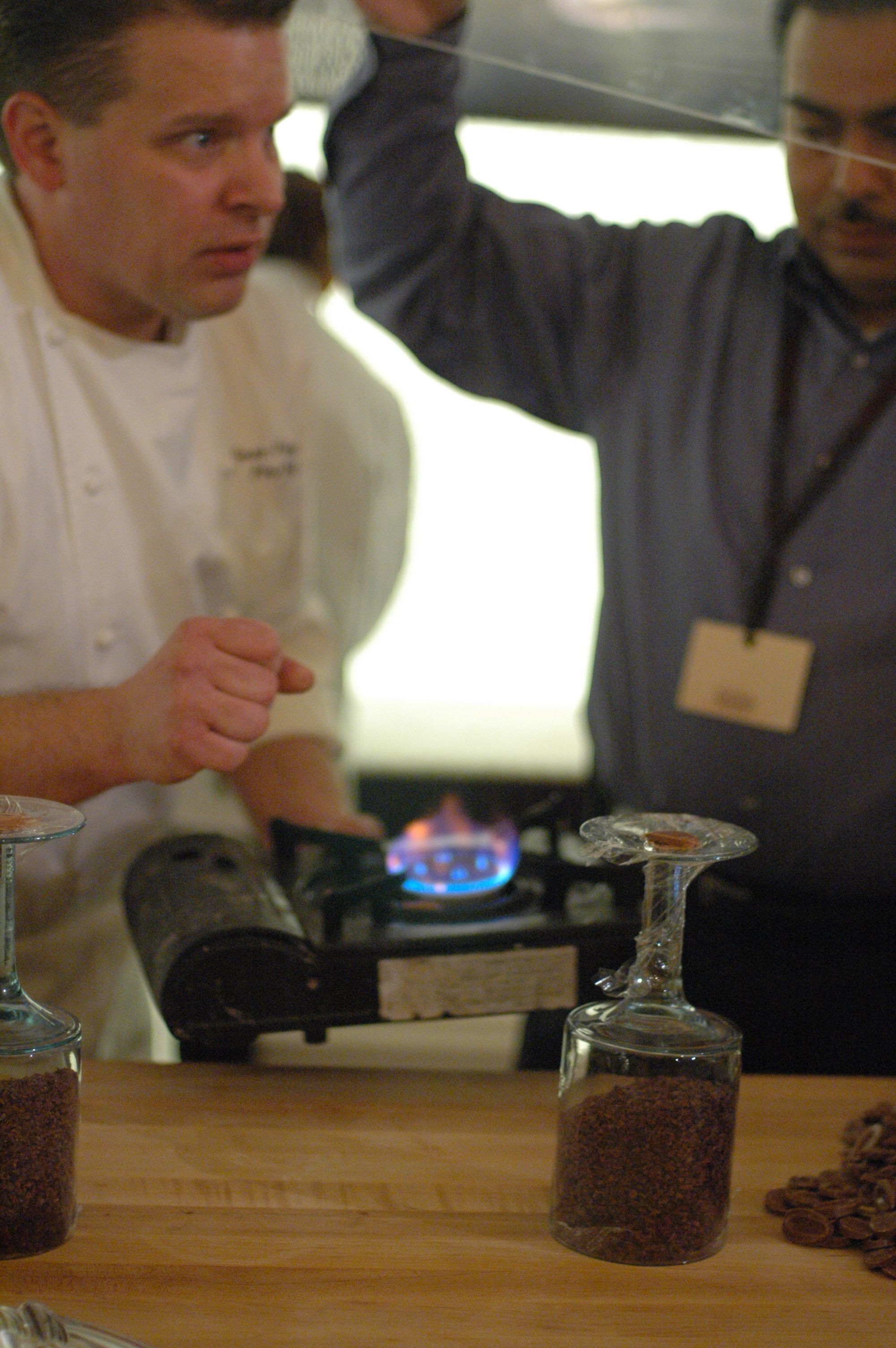 George Fritzche heats chocolate to create a "glue" for his display. George Fritzche heats chocolate to create a "glue" for his display.