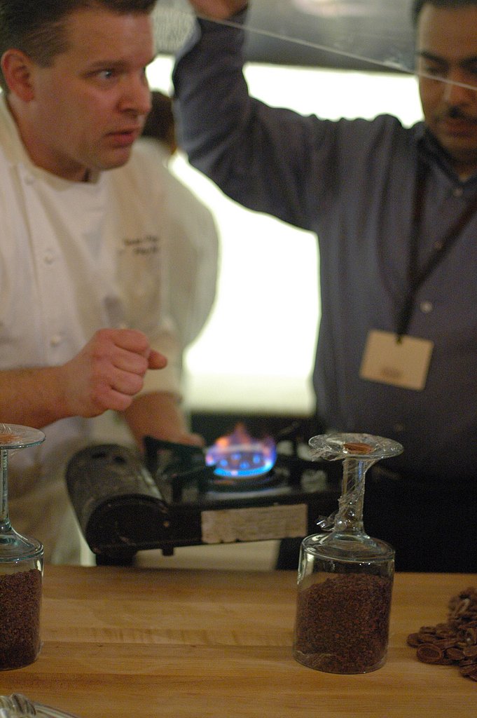 George Fritzche heats chocolate to create a "glue" for his display. George Fritzche heats chocolate to create a "glue" for his display.