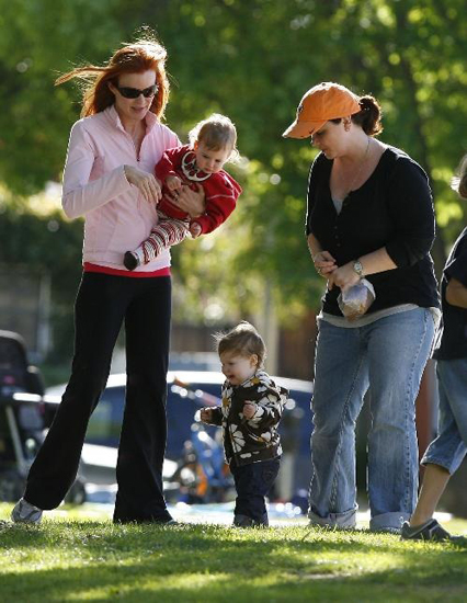 Red hot mama Marcia Cross took twins Eden and Savannah and parked it up in the California sunshine. Red hot mama Marcia Cross took twins Eden and Savannah and parked it up in the California sunshine.