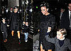 Victoria Beckham In Milan Wearing Black Coat, Christian Louboutin Boots, and Crystal Headband