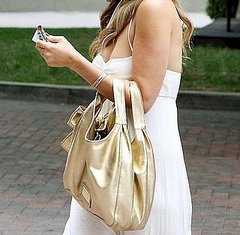 Guess Which Celeb Is Carrying a Gold Metallic Valentino? 