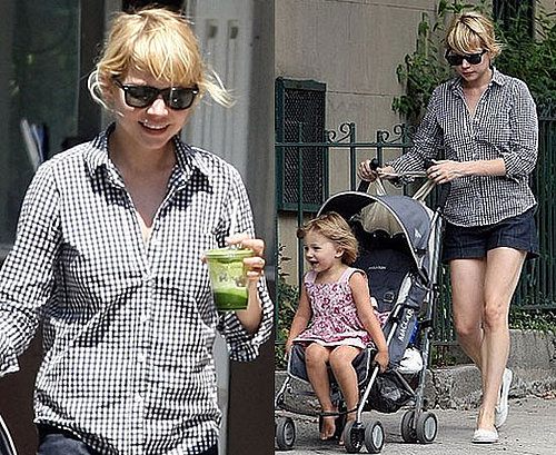 Michelle Williams in a black and white gingham shirt with baby Matilda