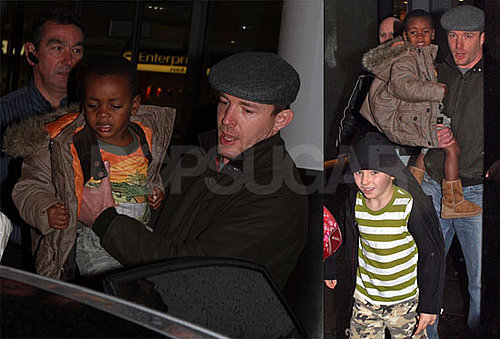Photos of Guy Ritchie, Rocco Ritchie, and David Banda at London Gatwick Airport