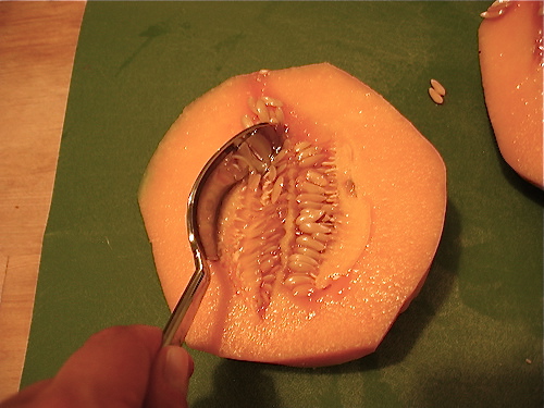 Using a large spoon, scoop out and discard all of the seeds.
Using a large spoon, scoop out and discard all of the seeds.