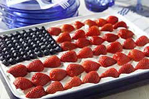 This uber-easy flag cake is made with frozen pound cake and cool whip.
This uber-easy flag cake is made with frozen pound cake and cool whip.