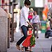 Suri Flashes a Smile For the Paps