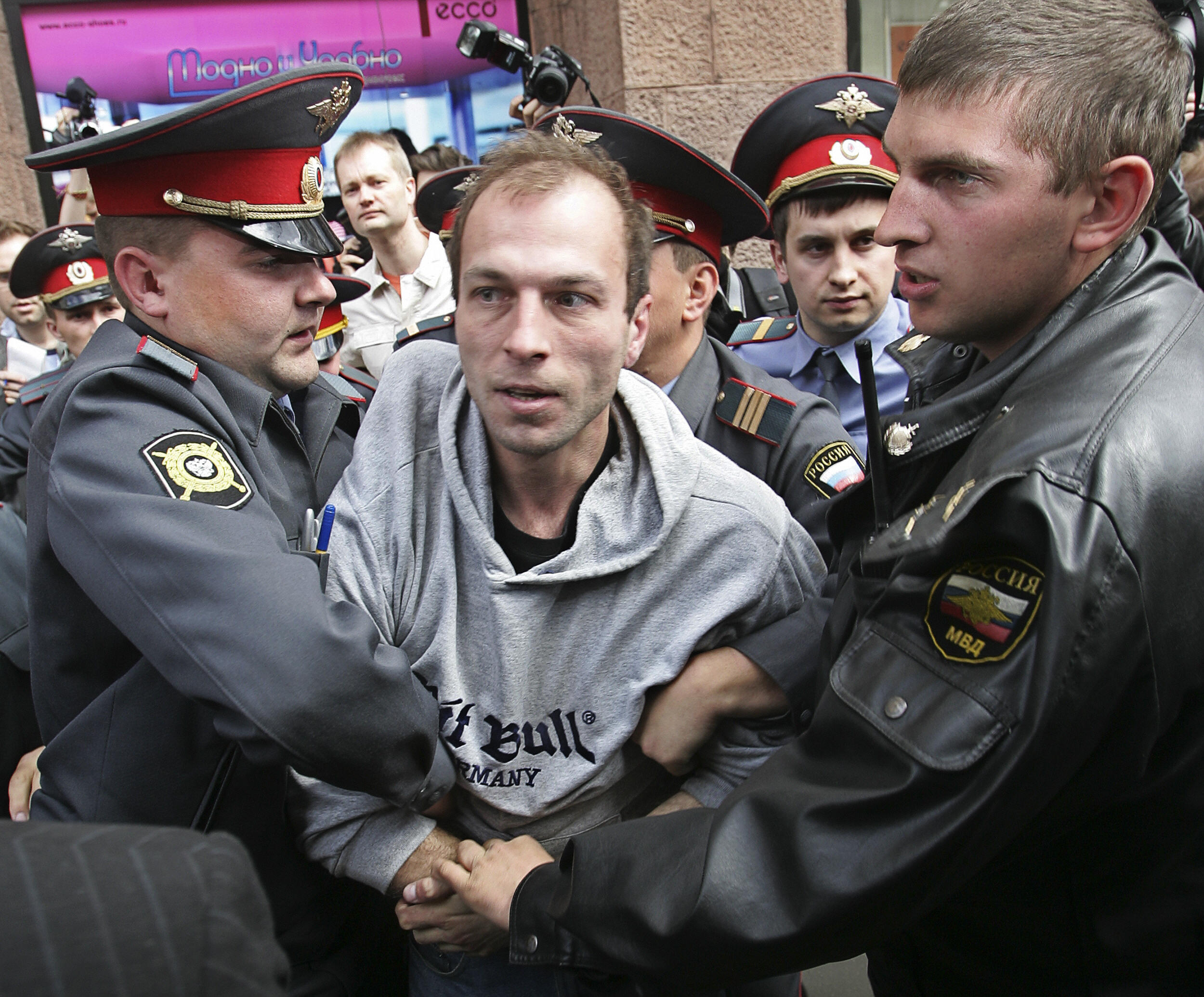 Russian police forces arrest a far-right activist during a banned gay rally. Russian police forces arrest a far-right activist during a banned gay rally.