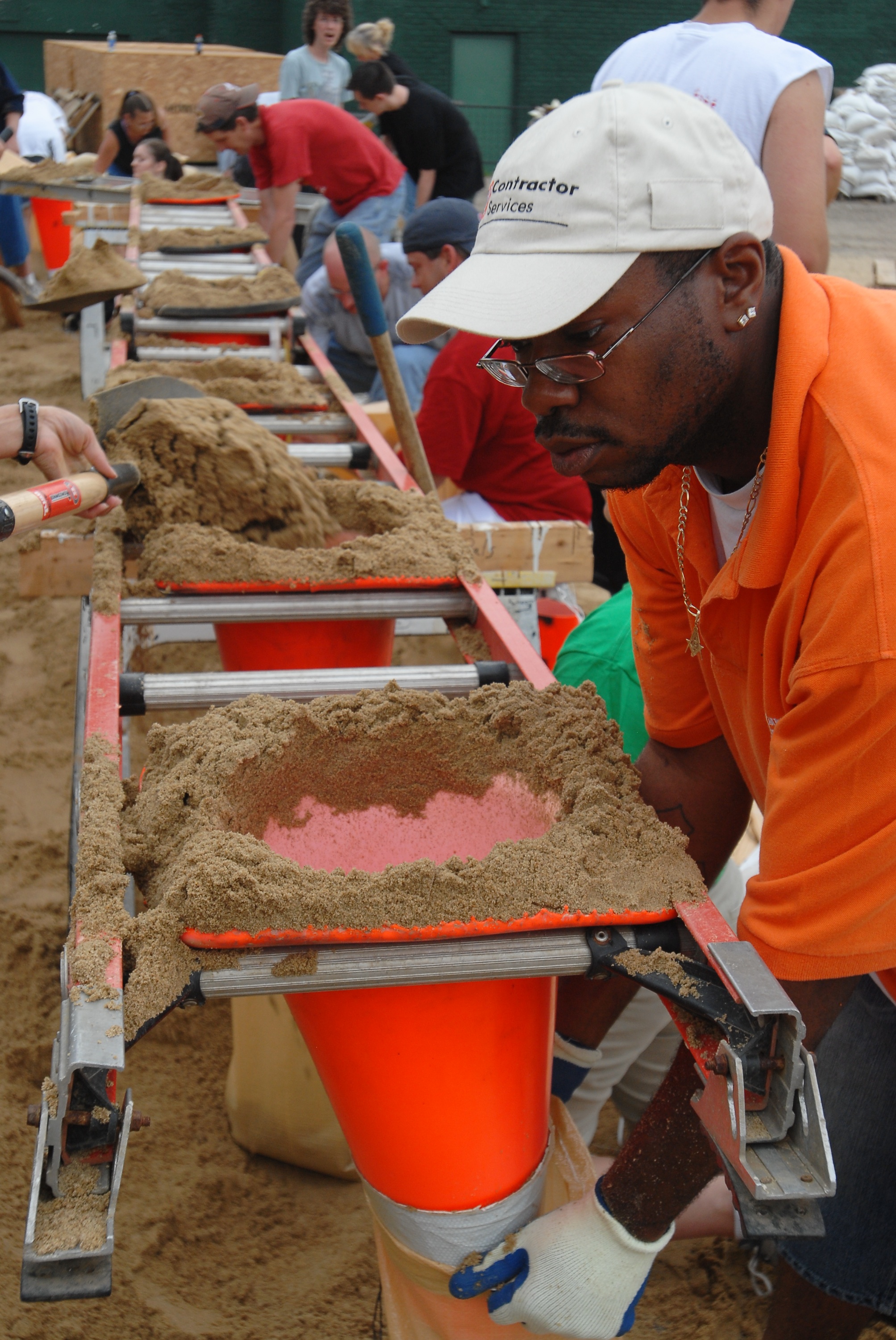 A resident rushes to fill sandbags. A resident rushes to fill sandbags.