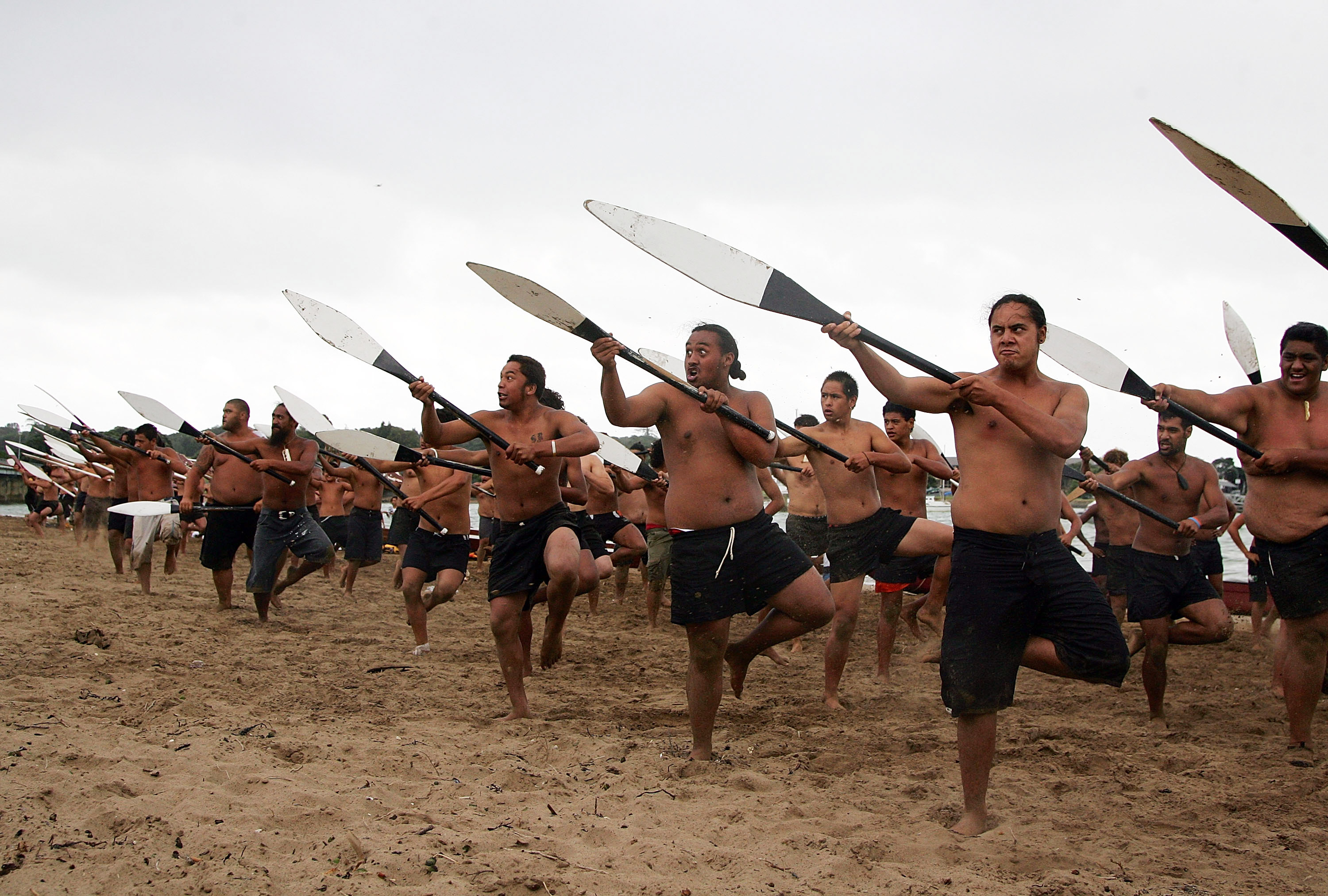 Maori warriors practice a haka at Te Ti Bay the day before Waitangi Day (NZ's national holiday). Maori warriors practice a haka at Te Ti Bay the day before Waitangi Day (NZ's national holiday).