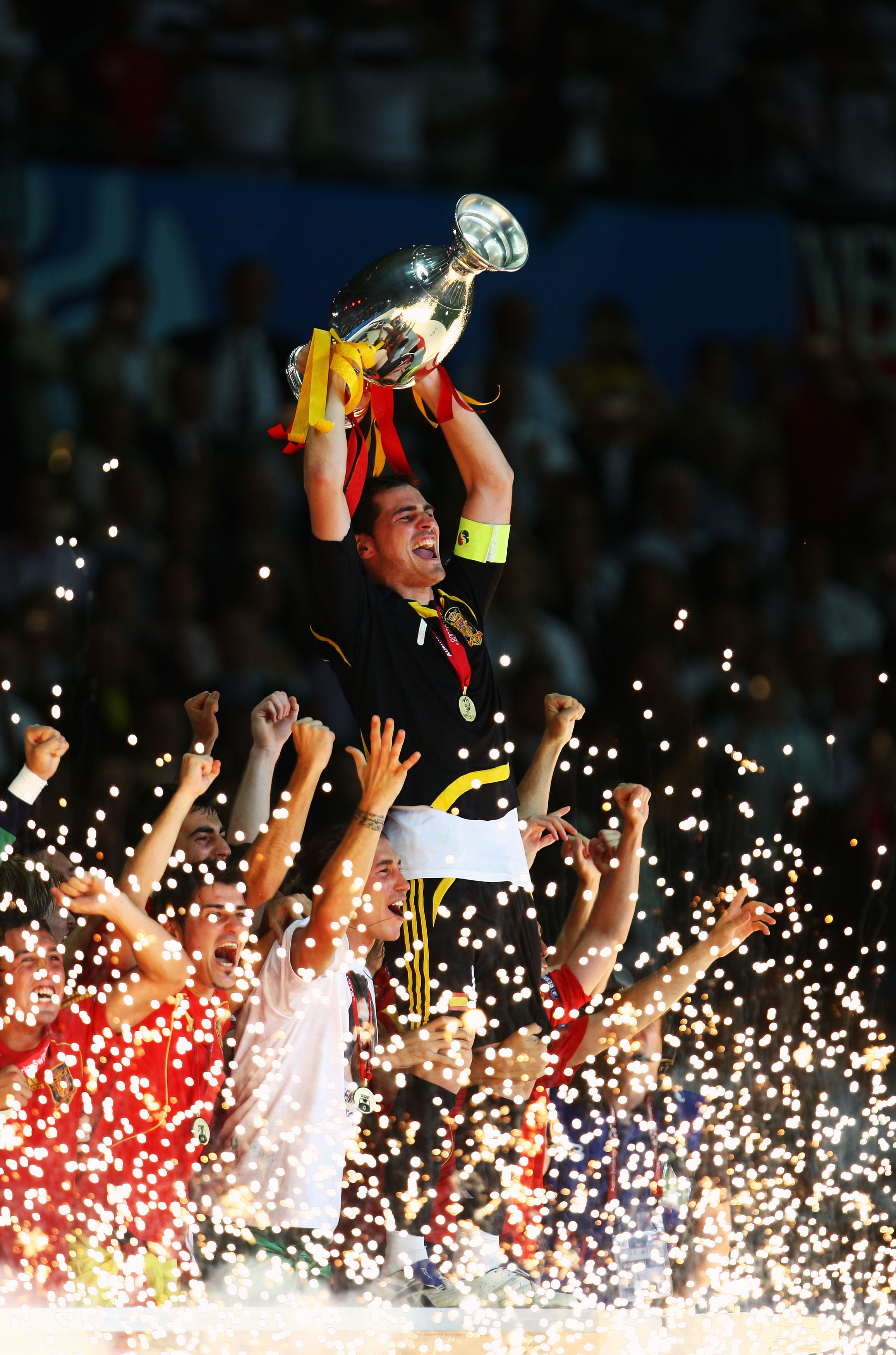 Captain Iker Casillas of Spain lifts the trophy after winning. Captain Iker Casillas of Spain lifts the trophy after winning.