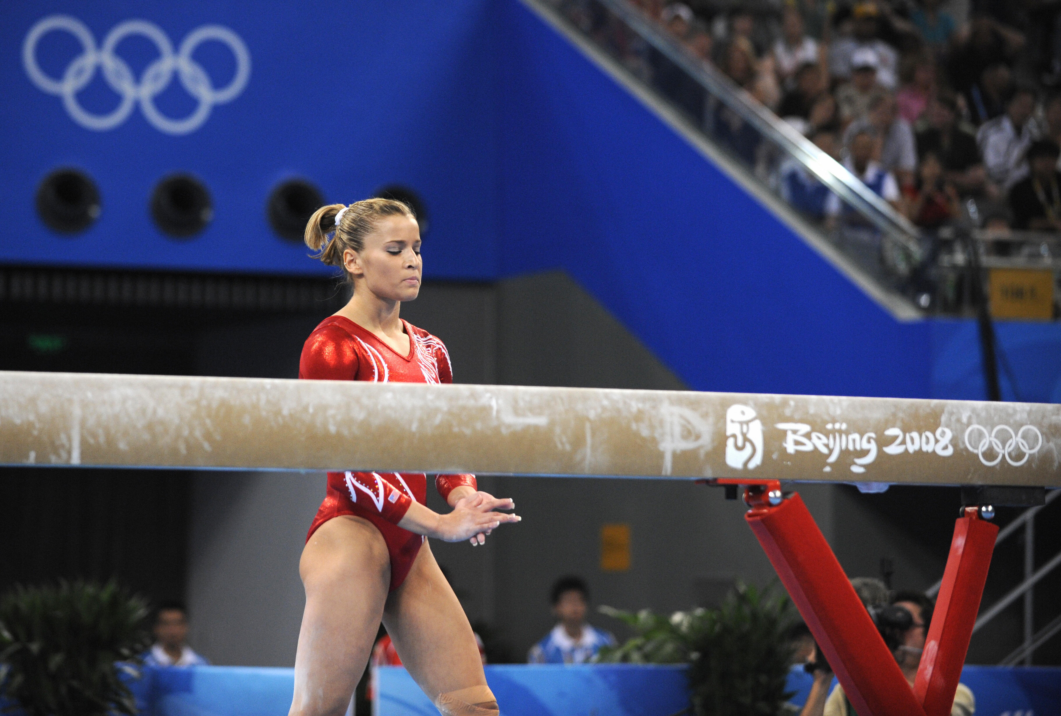 Alicia Sacramone goes back on the beam after falling. Alicia Sacramone goes back on the beam after falling.