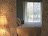 Cool Idea: Fabric Panels Frame a Bed