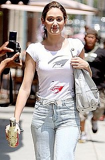 Emmy Rossum in LA Wearing a Message T-Shirt, Bow Belt, and Light Wash Jeans