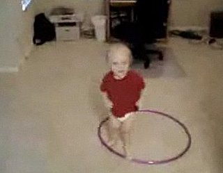 Baby Tries to Hula Hoop