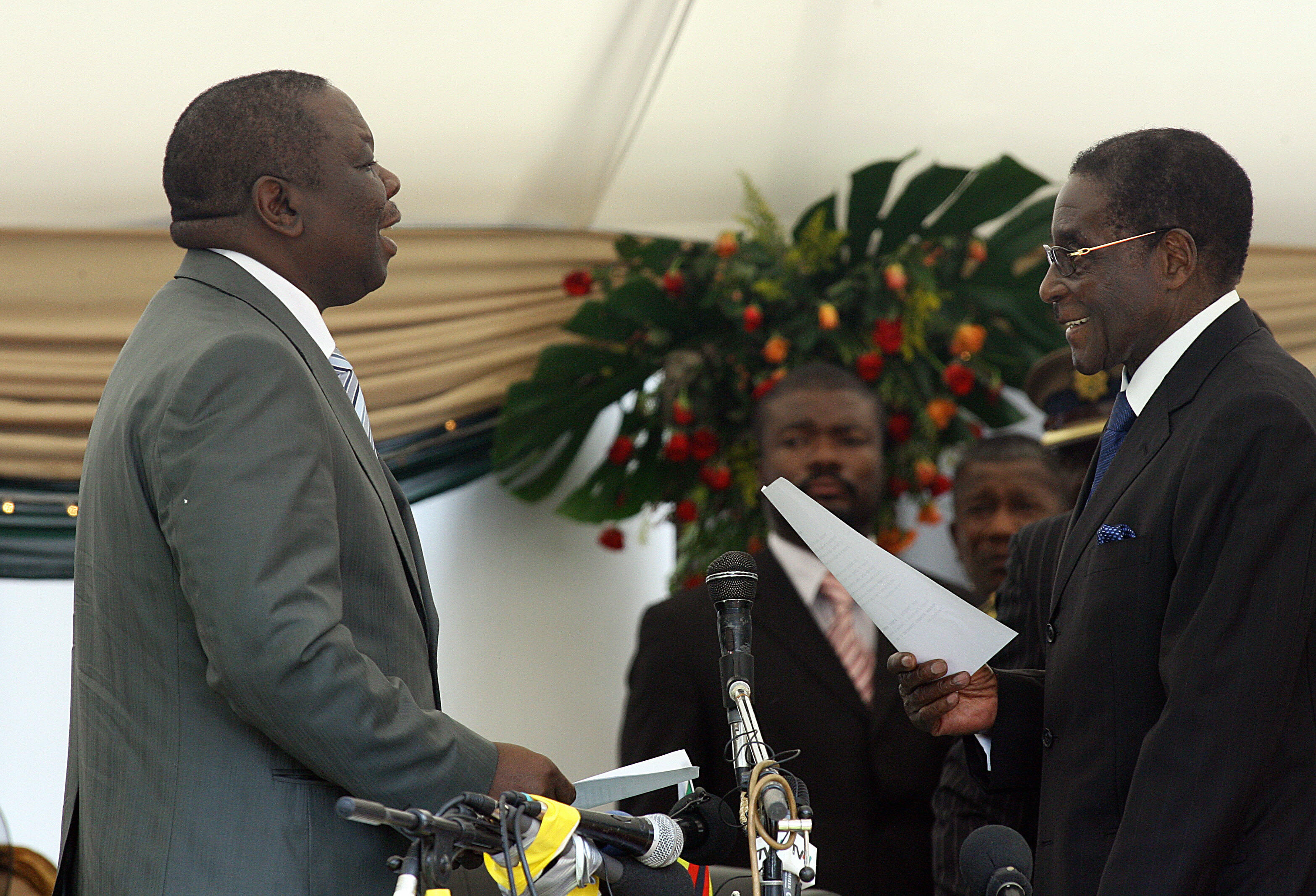 Zimbabwe's opposition leader Morgan Tsvangirai, head of the Movement for Democratic Change (MDC), is sworn in by President Rober Zimbabwe's opposition leader Morgan Tsvangirai, head of the Movement for Democratic Change (MDC), is sworn in by President Rober