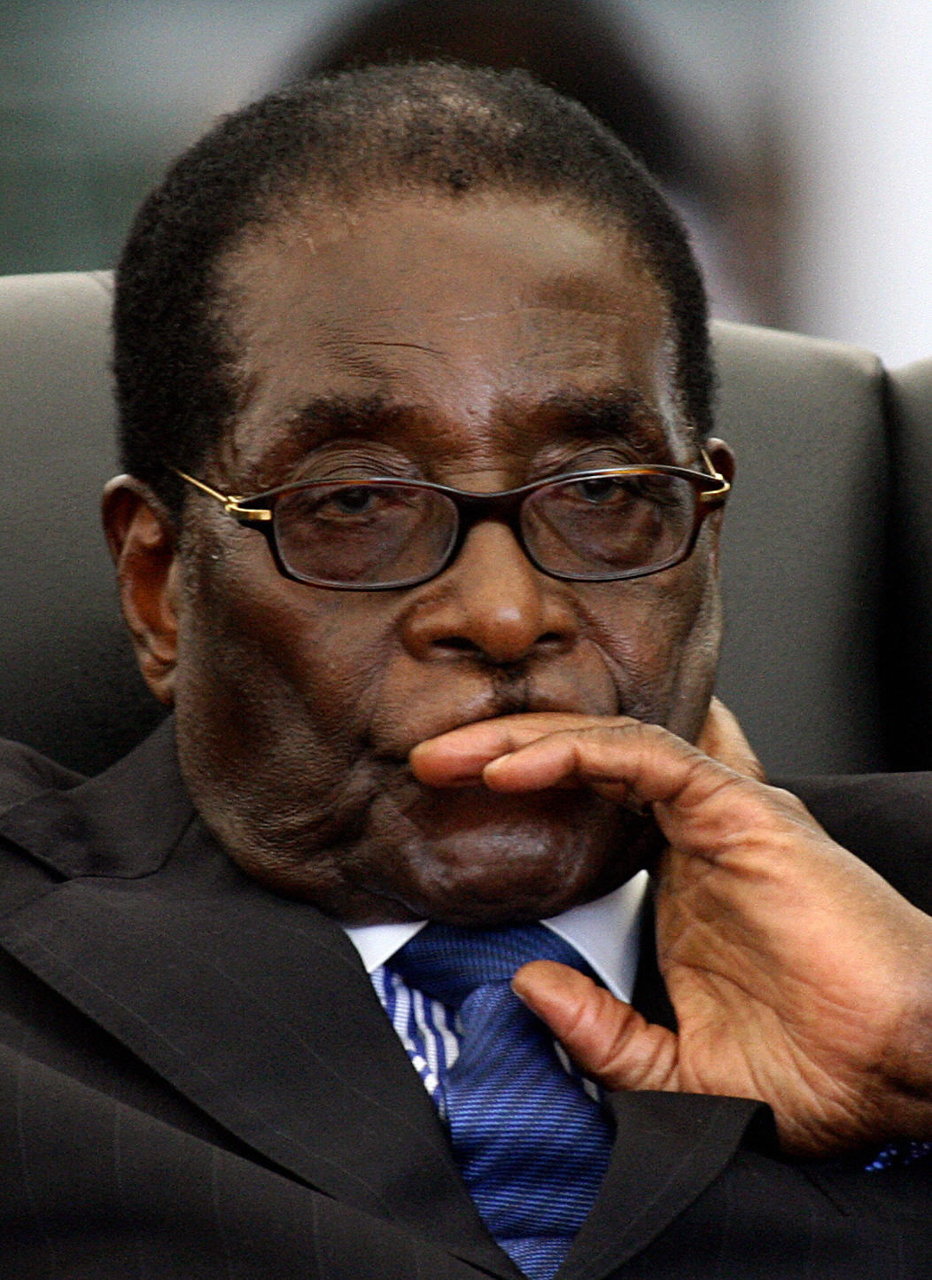 Zimbabwean President Robert Mugabe attends the swearing in ceremony of new Prime Minister Morgan Tsvangirai. Zimbabwean President Robert Mugabe attends the swearing in ceremony of new Prime Minister Morgan Tsvangirai.