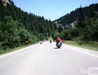 Deer Jumps Over Biker