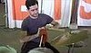 Man Knits While Playing Drums